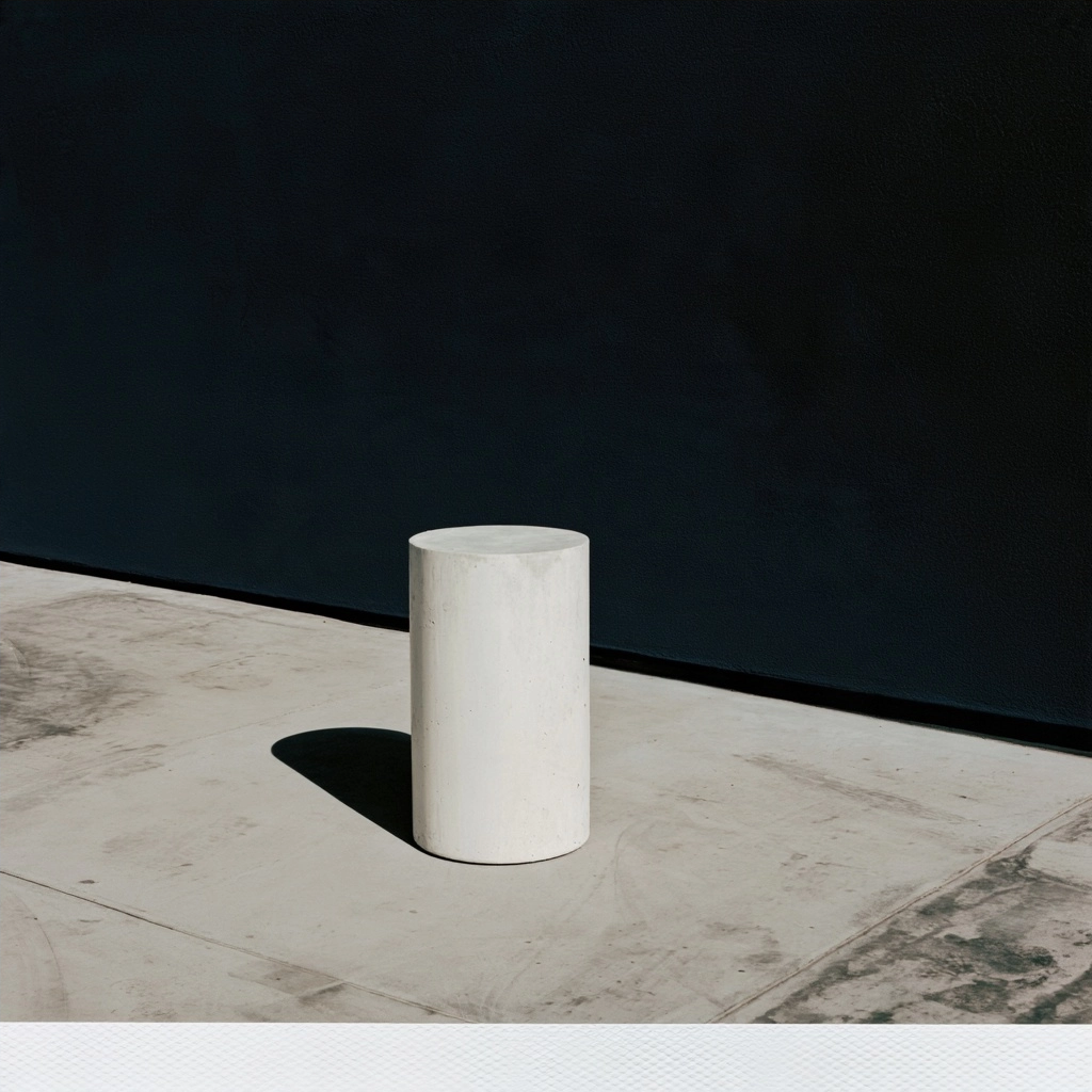 A minimalist white cylindrical podium centered on a light gray concrete floor against a dark background.